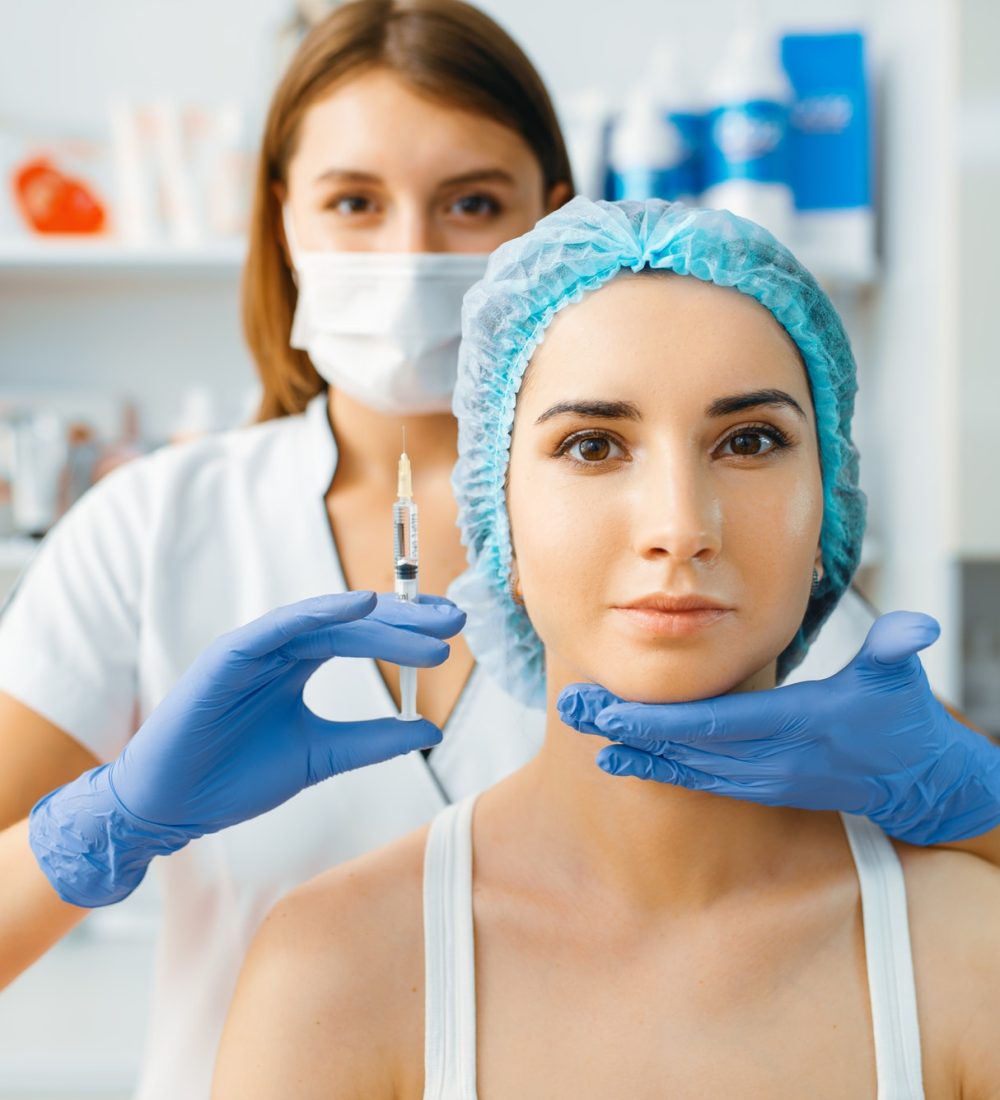 cosmetician-holds-syringe-with-injection-of-botox.jpg cosmetician-holds-syringe-with-injection-of-botox.jpg